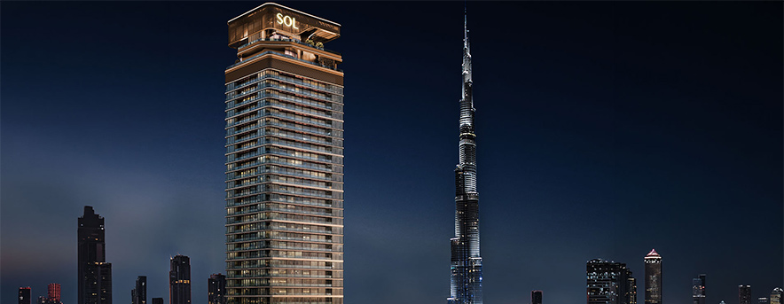 sol luxe tower and burj khalifa at night in dubai