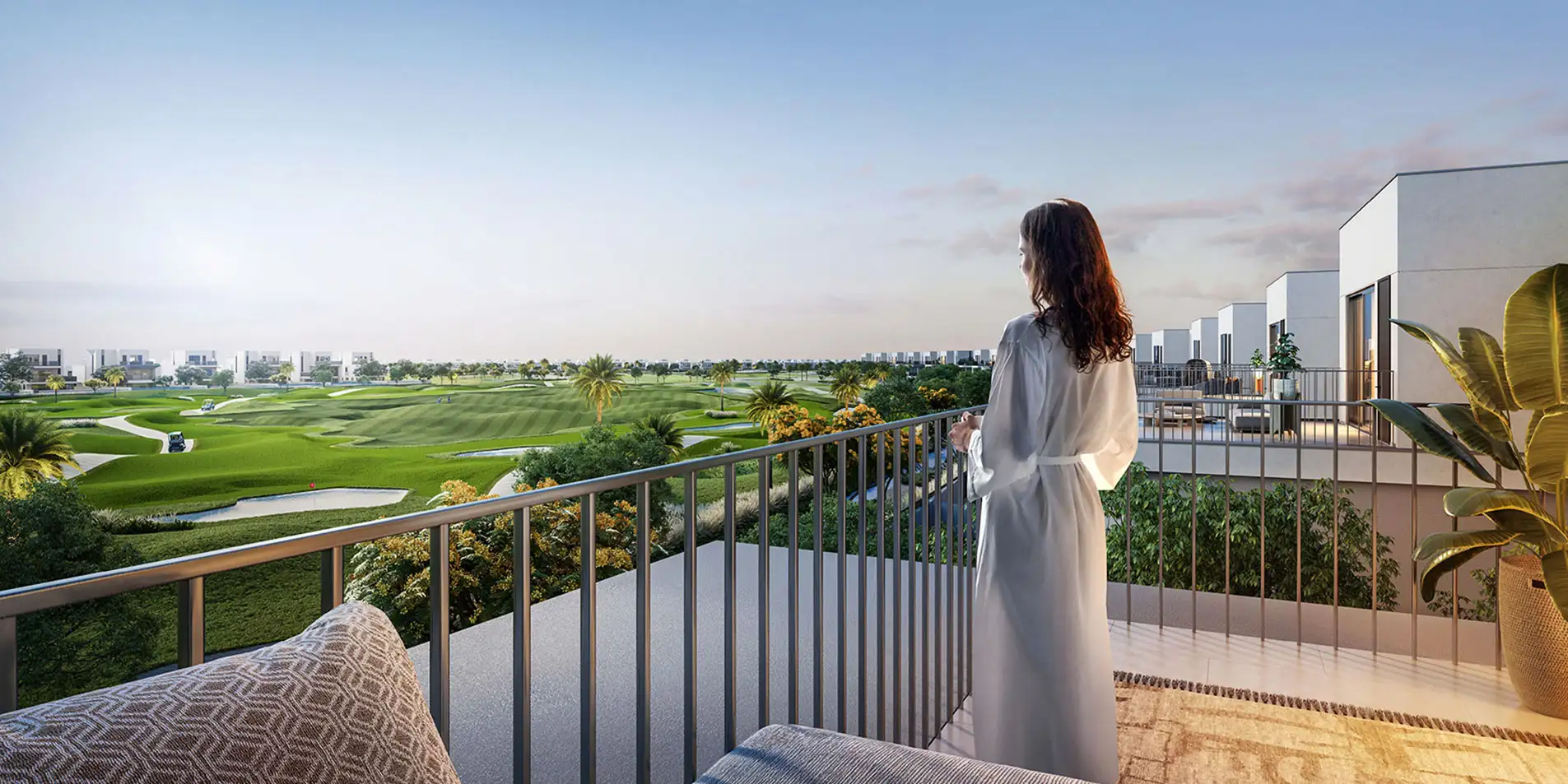 woman viewing the golf course from a golf lane balcony